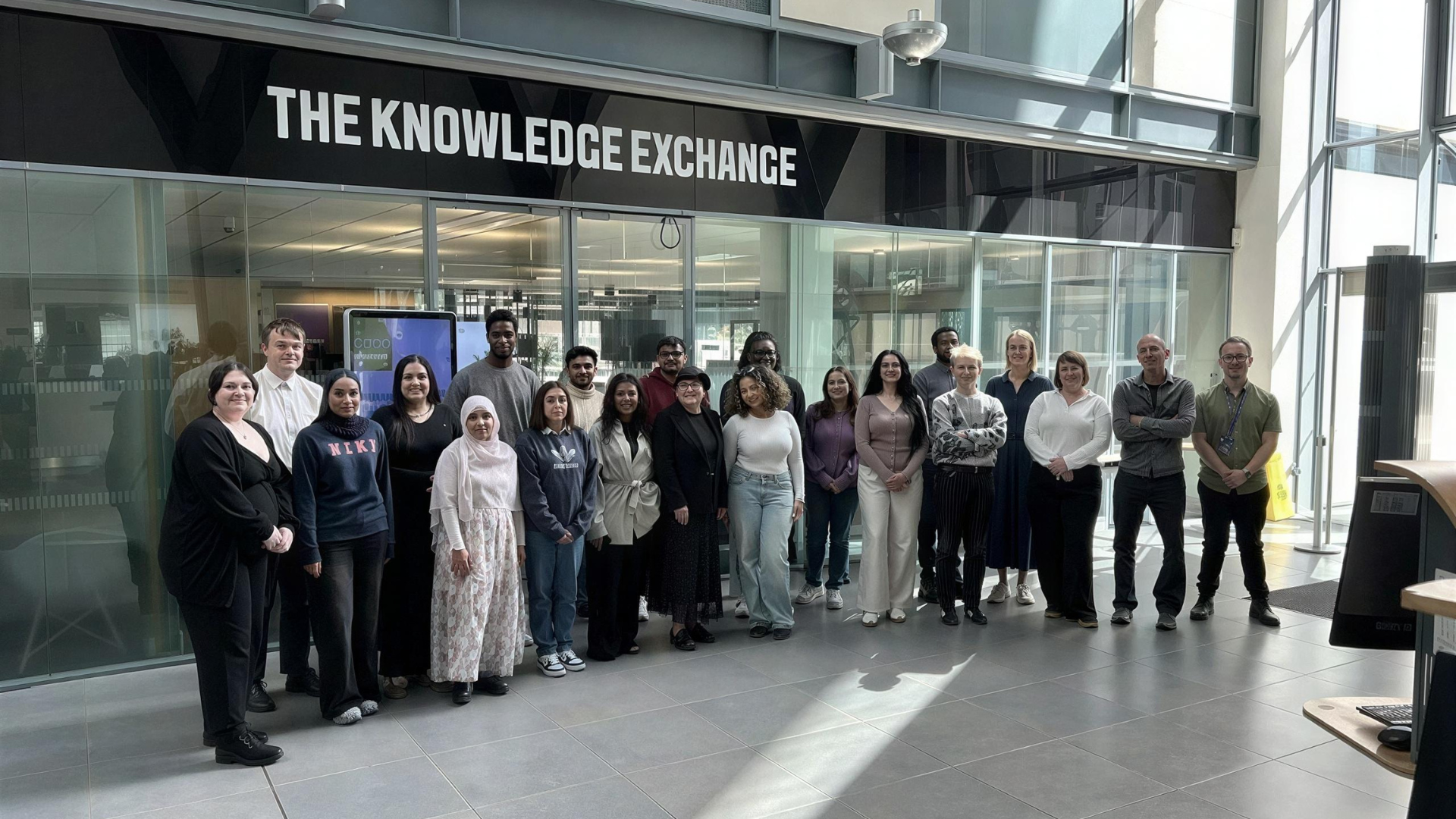 Project team members stood in front of The Knowledge Exchange.