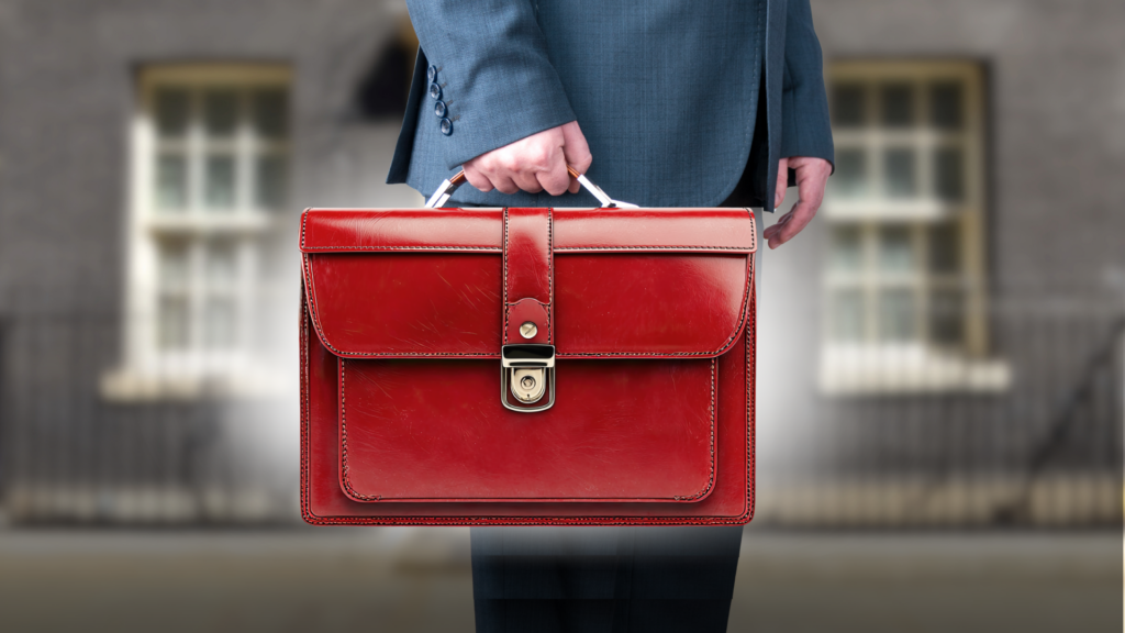 A man holding a red briefcase.